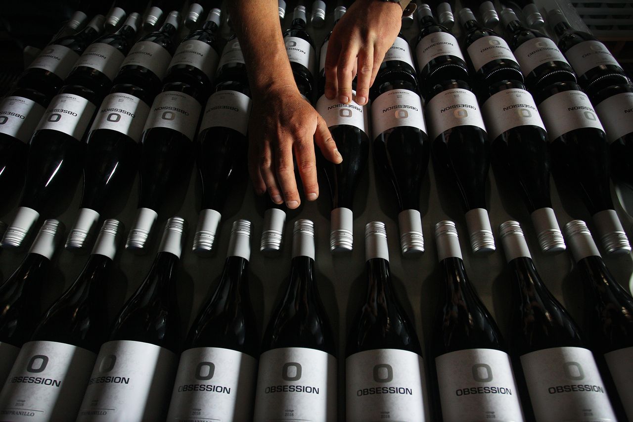 Adrian Brayne handles wine stock in the processing building at Obsession Wines on Nov. 24, 2020 in Tumbarumba, Australia.
Lisa Maree Williams/Getty Images Adrian Brayne handles wine stock in the processing building at Obsession Wines on Nov. 24, 2020 in Tumbarumba, Australia.
Lisa Maree Williams/Getty Images