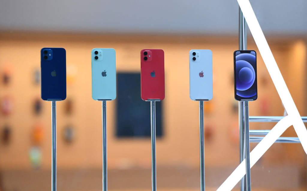 SYDNEY, AUSTRALIA - OCTOBER 23: A line up of the new Apple iPhone 12 inside the window of the Apple Store in George Street on October 23, 2020 in Sydney, Australia. The iPhone 12 features the A14 Bionic chip CPU, 6.1 inch OLED display, 5G connectivity and an advanced dual-camera system. The iPhone 12 Pro has a 6.1 inch OLED Super Retina XDR display and features triple rear cameras including an Ultra Wide camera and a telephoto camera along with the A14 Bionic chip CPU and 5G connectivity. (Photo by James D. Morgan/Getty Images)