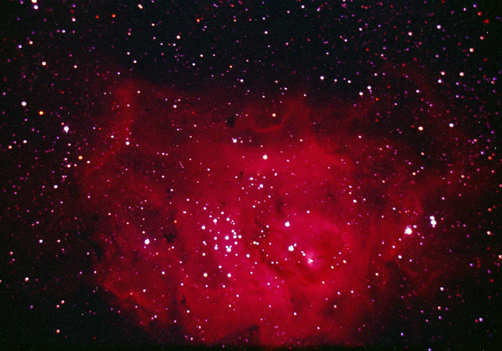 The Lagoon Nebula, also know as M8, is located in the constellation Sagittarius. It is approximately 4-6 thousand light years from earth in the general direction of the center of our galaxy.