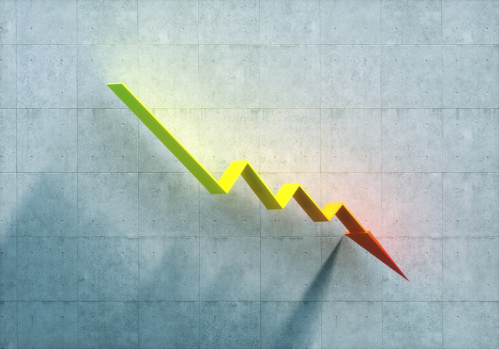 Digital generated image of multi colored arrow sign pointing downwards against concrete wall. Concept of loss and stock market crash.