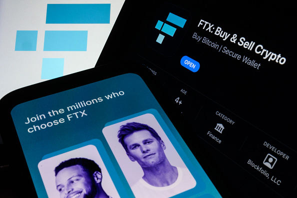 LONDON, ENGLAND - NOVEMBER 10: In this photo illustration the FTX logo and mobile app adverts are displayed on screens on November 10, 2022 in London, England. The Bahamas-based crypto exchange's larger rival, Binance, walked away from a potential bailout deal, as FTX struggles with a wave of customer withdrawals that have created a liquidity crunch. (Photo Illustration by Leon Neal/Getty Images)