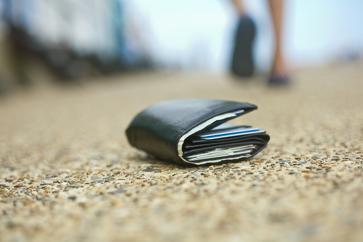 Lost wallet lying on the ground, Southwold, Suffolk, United Kingdom