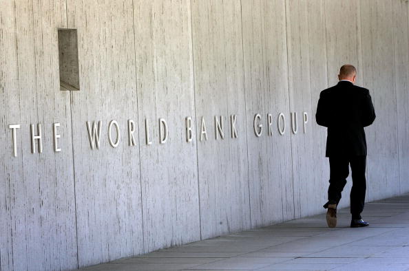 WASHINGTON - MAY 08:  An employee walks outside the World Bank headquarters May 8, 2007 in Washington, DC. Recent reports indicate that the global financial institution may soon resolve controversies surrounding its President Paul Wolfowitz.  (Photo by Win McNamee/Getty Images)